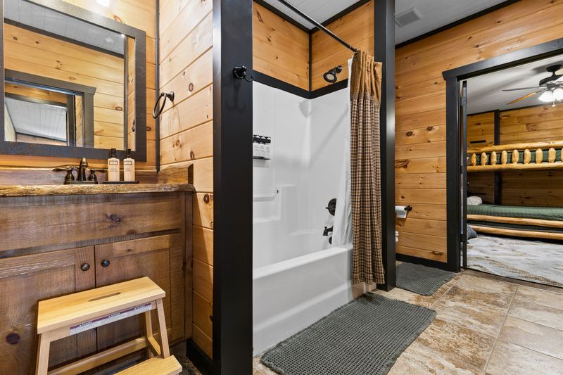 The lower-level bath with a tub and shower