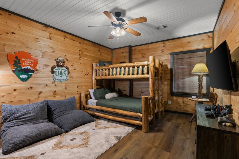 The bunk room's log bunk and TV