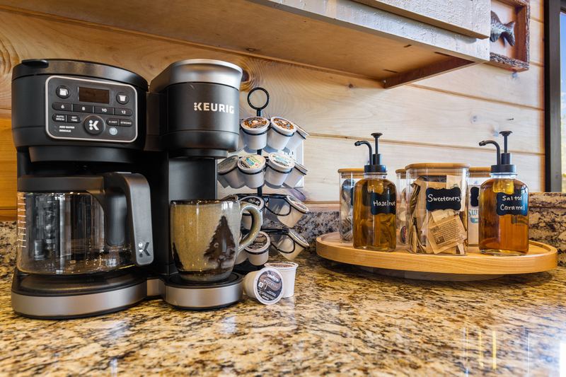 The coffee bar with a Keurig K-Duo, pods and syrups