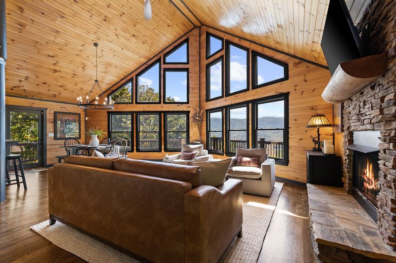 The great room under the vaulted pine ceiling