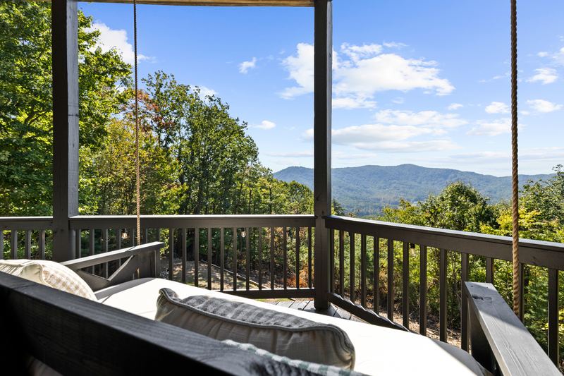 The hanging bed on the covered deck