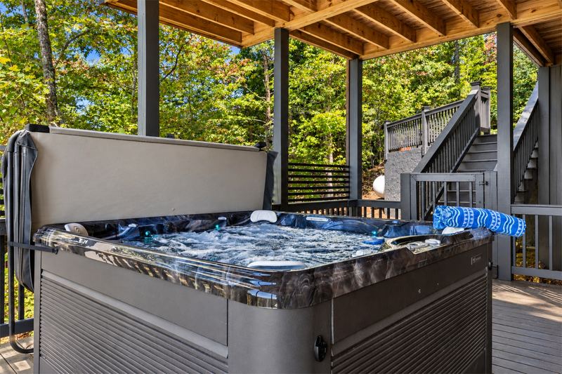The hot tub and the stairs down to the yard