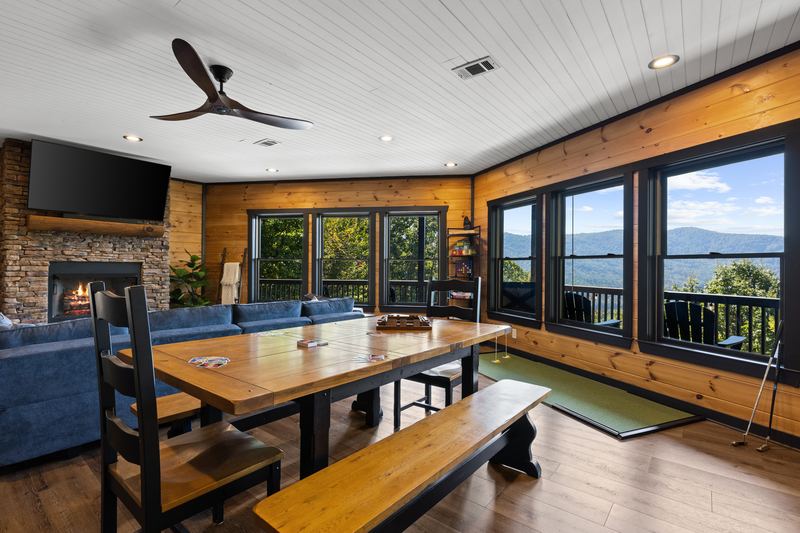 The lower living room, with the long game table and mountain views